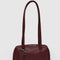 mahogany small dome recycled leather bowler bag with silver charm clasp