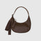 small brown recycled leather crescent bag with monochromatic strap
