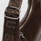 up close of silver buckle on small brown recycled leather crescent bag with monochromatic strap