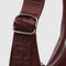 silver buckle on mahogany recycled leather small crescent bag with silver charm clasp