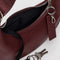 interior black key leash of mahogany recycled leather small crescent bag with silver charm clasp