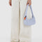 model holding grey lavender swan shaped bag