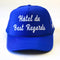 royal blue trucker hat with white 'HOTEL du BEST REGARDS' across the front