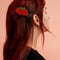 model wearing mega berry hair clip
