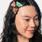 model wearing set of three colorful moth hair clips