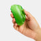 model holding lime green translucent hair claw with wavy edges
