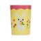 front view of pale yellow and mauve juice glass with bunny and floral print