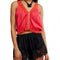 model wearing bright red cotton tank with button front and lace applique detail down the front and hem