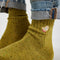 model wearing yellow crew socks with mitten detail