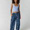 model wearing navy pinstripe balloon lounge pants with white dainty floral print