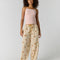 model wearing cream pinstripe balloon lounge pants with yellow dainty floral print