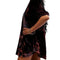 side view of model wearing black velvet tunic with red and burgundy floral print and short sleeve puff sleeves