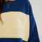 up close of model wearing royal blue and yellow large stripe henley top