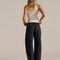 back view of model wearing washed black relaxed fit low rise denim