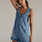 model wearing light denim pull on shortalls with zipper front