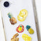 pineapple stickers on a phone