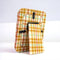 back view of yellow fabric 4x5 picture frame with pale yellow, mint and burnt red plaid print