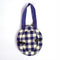 back view of navy and cream gingham round fabric frame ornament