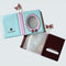 mini photo album with blue and lavender frame and black with blue micro polka dots inside