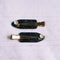 set of two dark green marbled setting clips with dainty white flower and gold accent