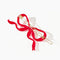 back view of red ribbon bow hair clip