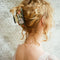 model wearing orange and pink floral vintage lamp vintage hair claw