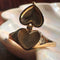 opened gold ring with heart shaped locket