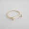 gold band ring with clear crystal baguette stone