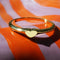 front view of gold mini heart signet ring