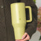 model holding olive green 40 oz large tumbler with handle