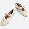 creme mary jane flats with elastic back and thick buckle strap with silver grommets and buckle