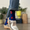 model wearing royal blue crew socks with brick abstract floral print
