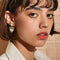 model wearing two tiered heart dangle earrings