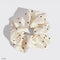 cream satin hair scrunchie with black rhinestone mickey design