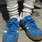 model wearing white textured fluffy socks with sneakers