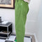 side view of model wearing pistachio green arc pants with side pockets