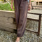 model wearing cotton chocolate brown balloon pants with side pockets