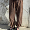 model wearing cotton chocolate brown balloon pants with side pockets