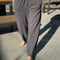 model wearing cotton dark slate balloon pants with side pockets