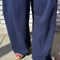 up close of model wearing navy flowy pants