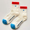 white crew socks with red trim and light blue embroidered heart