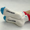 bottom view of model wearing white crew socks with red trim and light blue embroidered heart