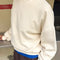 side view of model wearing naturel relaxed fit french terry sweatshirt