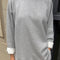 model wearing heather grey relaxed fit raglan sweatshirt