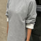model wearing heather grey relaxed fit raglan sweatshirt