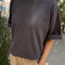 model wearing dark slate oversized tee with extended sleeves