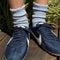 model wearing light blue ribbed scalloped socks with sneakers