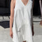 model wearing white denim mini dress