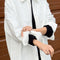 model wearing un-buttoned oversized cotton white button down top