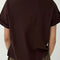 back view of model wearing dark brown relaxed fit tee